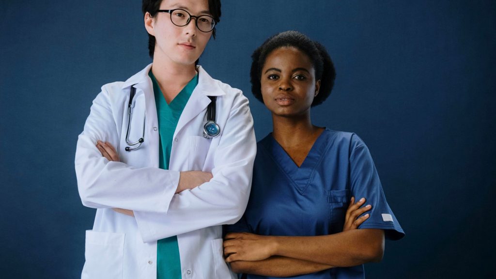 Two doctors wearing medical uniforms