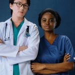 Two doctors wearing medical uniforms
