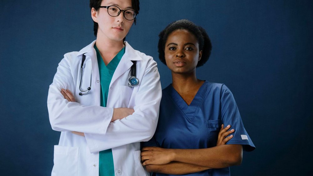 Two doctors wearing medical uniforms